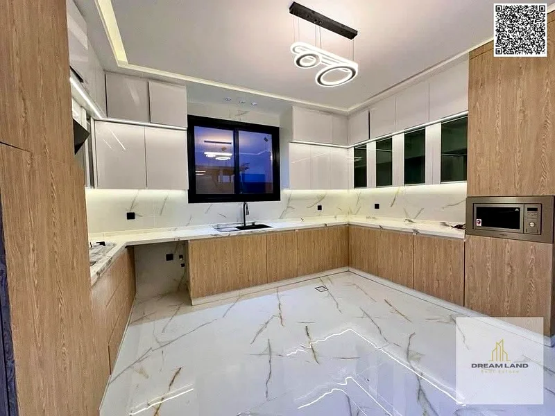 For sale, a villa, including registration and ownership fees, directly opposite the mosque, two floors, stone facade, with the possibility of easy ban63898224422402114
