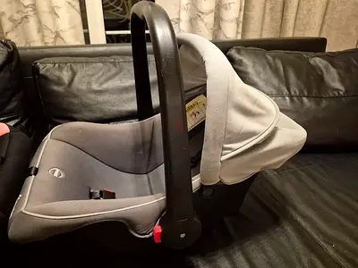 Baby car seat cum carry cot with sun shade