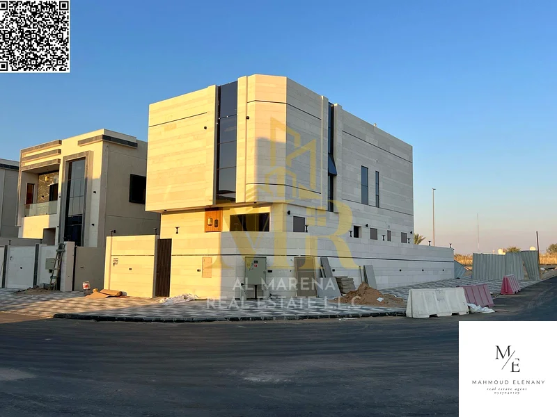 For Sale – Luxury Corner Villa in Al Helio 2 – Ajman | 5 Master Bedrooms + Majlis & 2 Halls + Modern Kitchen + Full Central AC | Main Road & Close to63898440155779110