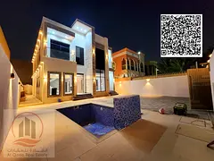 Villa for sale in Ajman, Al Rawda area (2), 5000 feet (swimming pool, 5 master bedrooms, majlis + 2