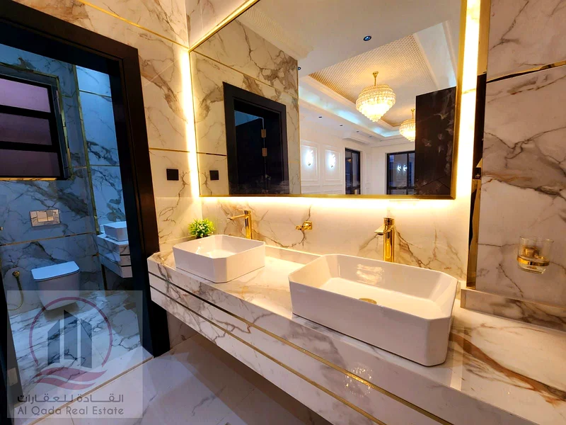 Villa for sale in Ajman, Al Helio 2 area, including registration fees (5 master bedrooms + large living room with sinks + large hall + maid's room + e63898098075649114