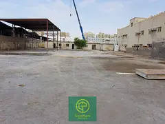 Al Sajaa 21,000 sq. Ft open land with built-in toilet and office