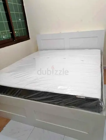 IKEA brimness queen size bed with 4 storage drawers underneath and with  IKEA mattress