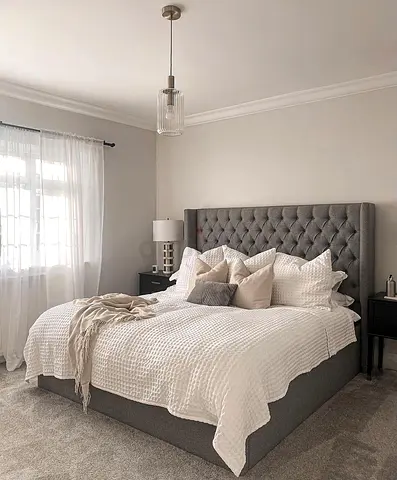 Stylish Gray Upholstered King-Size Bed with Luxurious Bedding