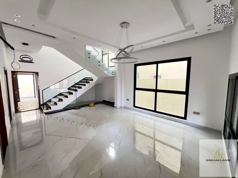 Villa for sale, including registration fees, in Ajman Al Bahia, 5 master bedrooms, a living room, 2 halls, and a maid's room. Freehold for all nationa63881481106945114