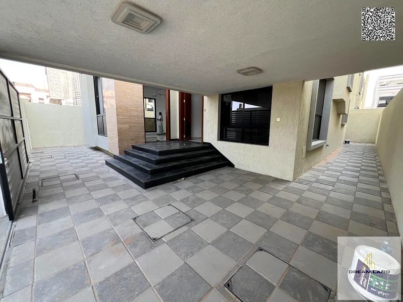 Villa for sale, including registration fees, in Ajman Al Bahia, 5 master bedrooms, a living room, 2 halls, and a maid's room. Freehold for all nationa63881481106945113