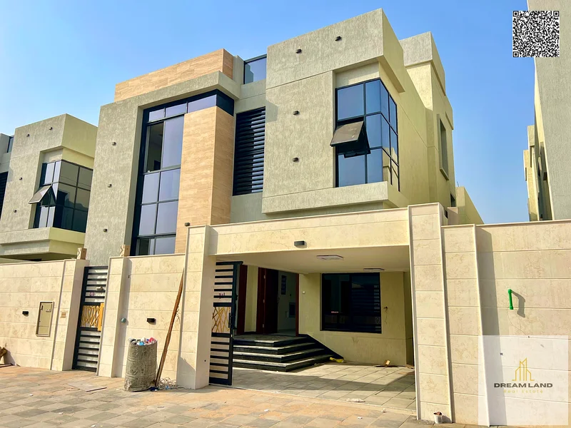 Villa for sale, including registration fees, in Ajman Al Bahia, 5 master bedrooms, a living room, 2 halls, and a maid's room. Freehold for all nationa63881481106945111