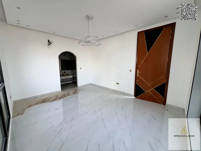 Villa for sale, including registration fees, in Ajman Al Bahia, 5 master bedrooms, a living room, 2 halls, and a maid's room. Freehold for all nationa63881481106945112