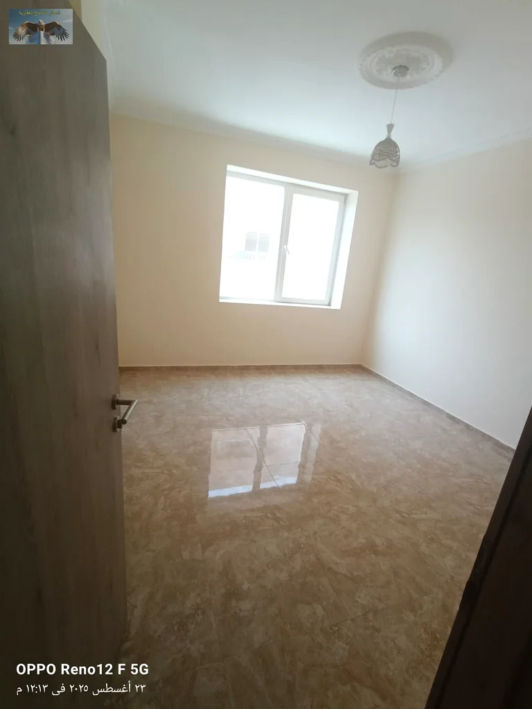 First tenant, two rooms and a hall with built-in wardrobes and a large balcony for annual rent in Al Rashidiya 2 in Ajman, excellent finishing63721248227970112