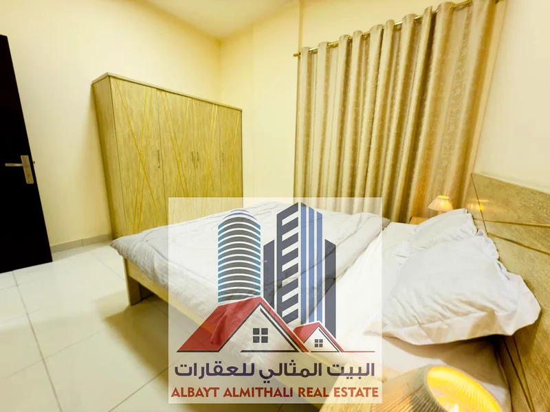 شقة واسعة مكونة من غرفتي نوم للإيجار في عجمان - الروضة 163722447450754113