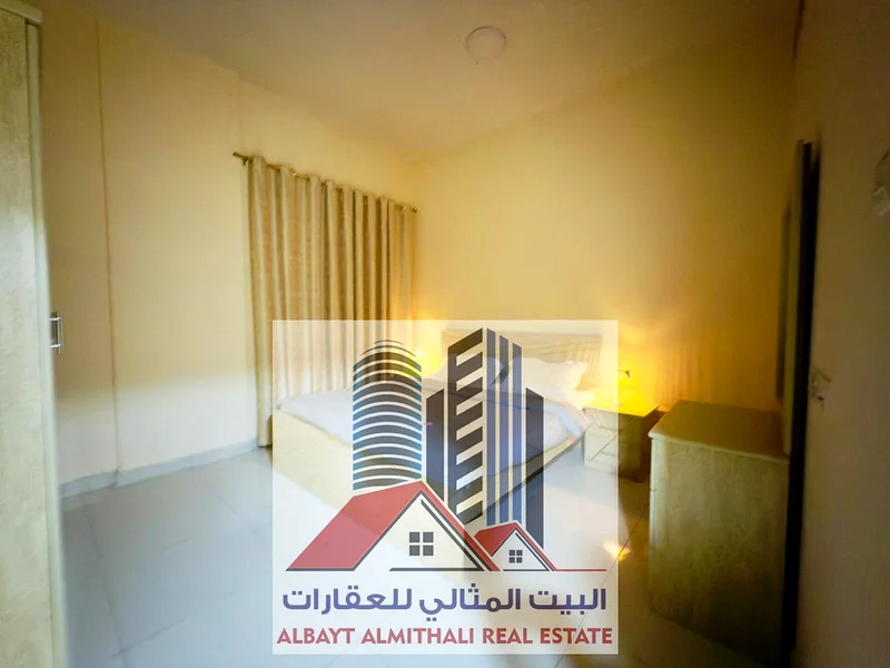 شقة واسعة مكونة من غرفتي نوم للإيجار في عجمان - الروضة 163722447450754110