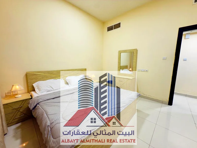 شقة واسعة مكونة من غرفتي نوم للإيجار في عجمان - الروضة 163722447450754112