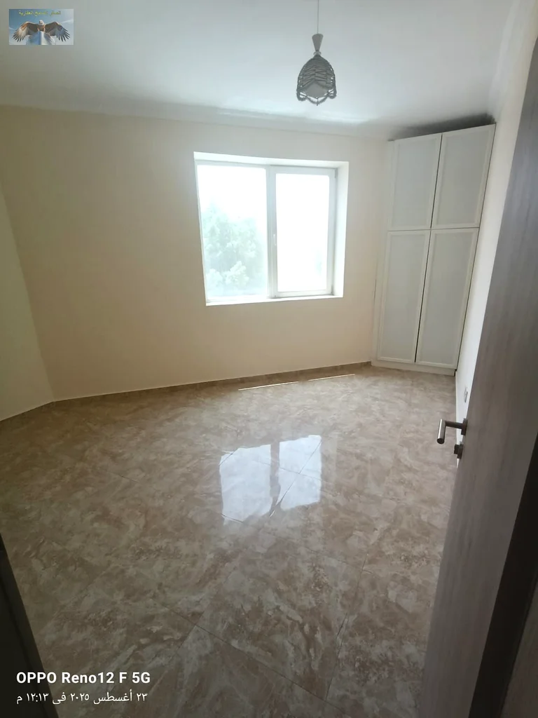 New apartment for the first tenant in Al Rashidiya 2, Ajman, two bedrooms and a hall with modern finishes, with two bathrooms, a large balcony, and bu63721701004547113