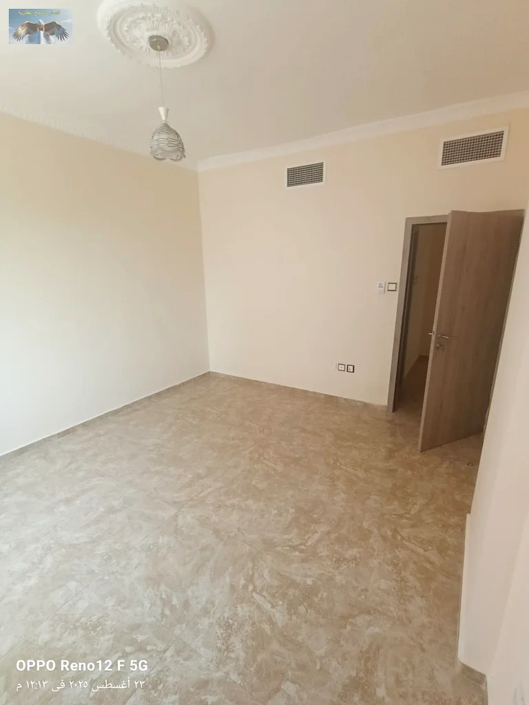New apartment for the first tenant in Al Rashidiya 2, Ajman, two bedrooms and a hall with modern finishes, with two bathrooms, a large balcony, and bu63721701004547114