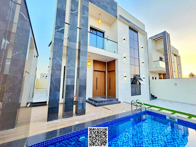 For sale - a luxury villa with a swimming pool in a prime location in Ajman, high-end finishing, modern design, including registration and owners63901036866562113