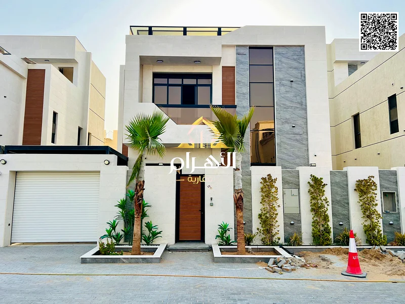 For sale - Luxury villa in Al Helio 2 - Ajman | 2 floors + roof | 6 master bedrooms | Majlis and 2 halls with swimming pool | Area 3100 sq ft includin63901036918401111