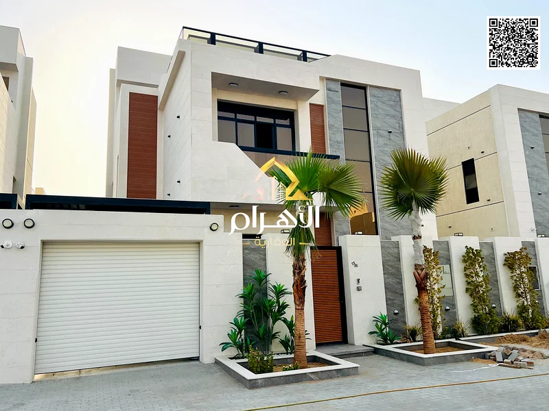 For sale - Luxury villa in Al Helio 2 - Ajman | 2 floors + roof | 6 master bedrooms | Majlis and 2 halls with swimming pool | Area 3100 sq ft includin63901036918401114