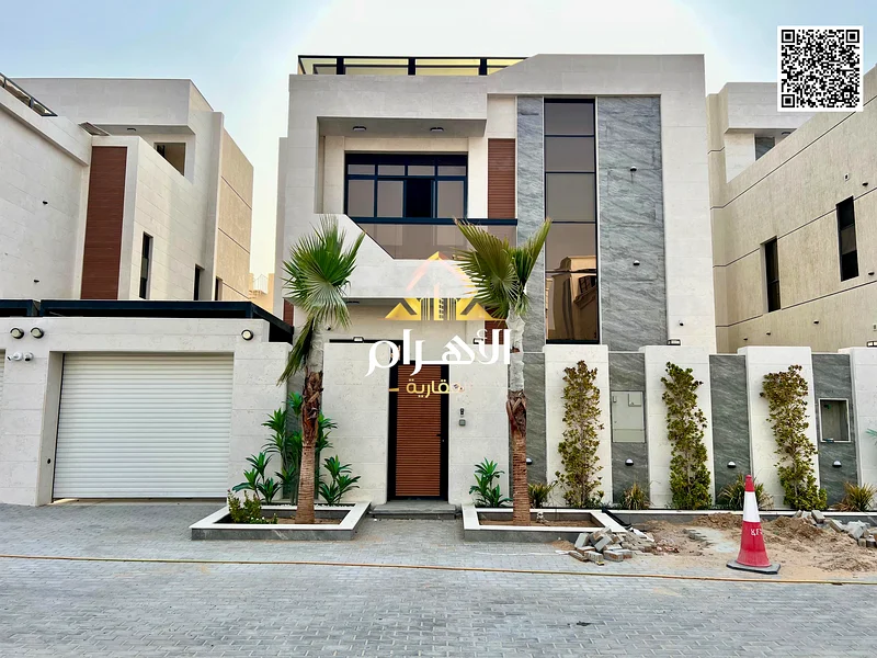 For sale - Luxury villa in Al Helio 2 - Ajman | 2 floors + roof | 6 master bedrooms | Majlis and 2 halls with swimming pool | Area 3100 sq ft includin63901036918401112