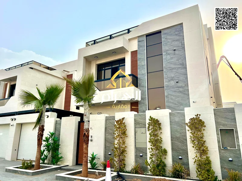 For sale - Luxury villa in Al Helio 2 - Ajman | 2 floors + roof | 6 master bedrooms | Majlis and 2 halls with swimming pool | Area 3100 sq ft includin63901036918401113