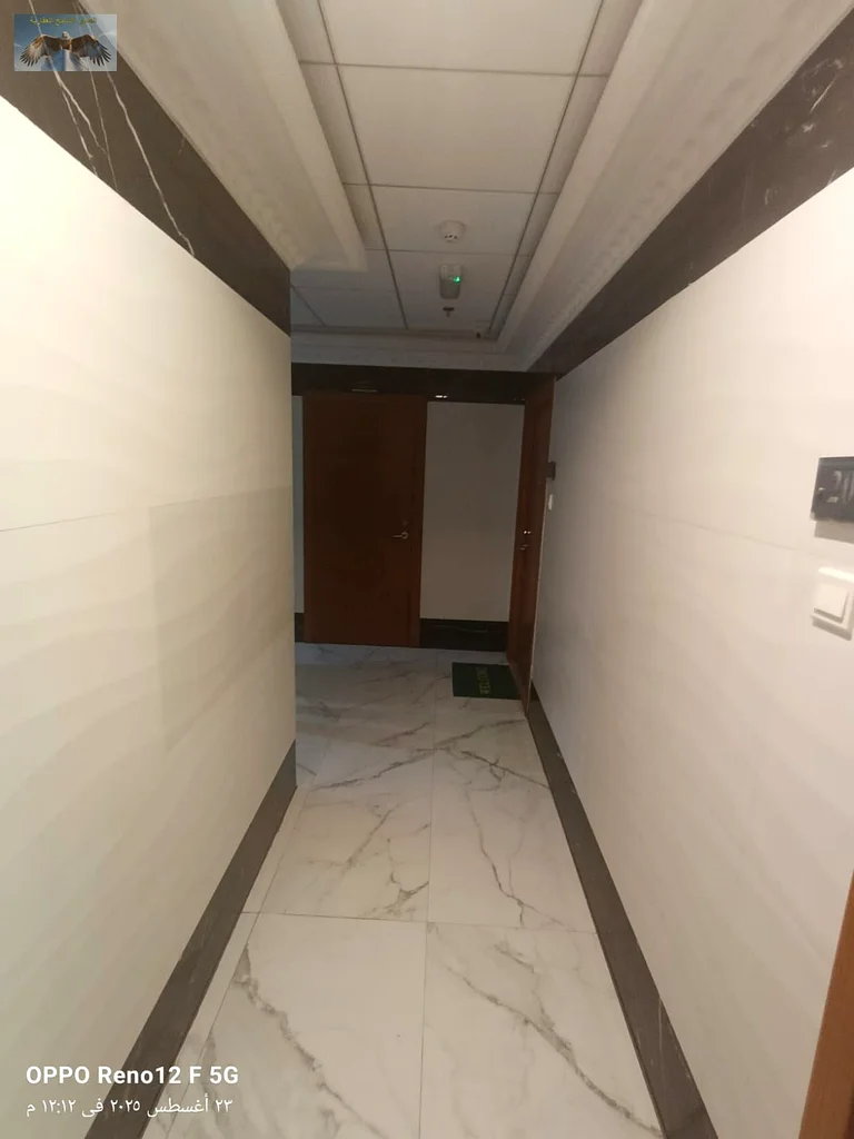 First-class apartment for rent in Al Rashidiya, 2 bedrooms, a hall, 2 bathrooms, a spacious balcony, wall-mounted wardrobes, central air conditioning,63721614302593113