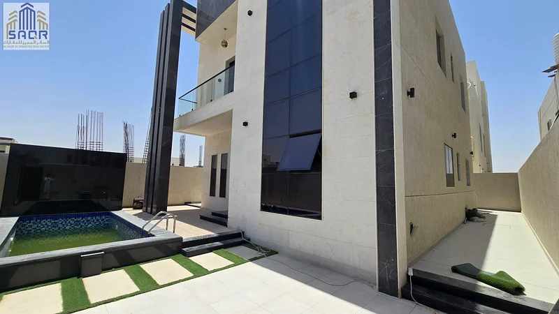 For sale - a luxurious villa with a swimming pool in a prime location in Ajman, high-end finishing, modern design, including registration and ownership63911619940610113