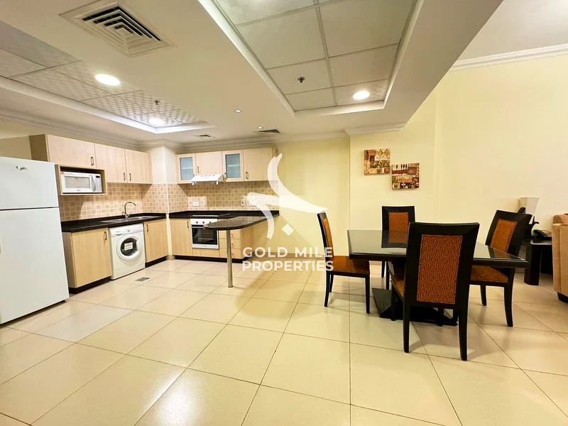 شقة واسعة من غرفتي نوم - مفروشة بالكامل - بدون رسوم المبرد - بالقرب من مول الإمارات63744806787329111