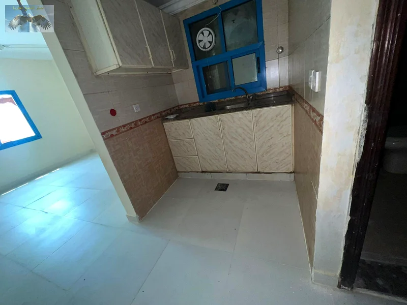 Spacious studio for annual rent in Al Rashidiya 2 – prime location near Falcon Towers, separate kitchen, clean building, and flexible payments63722544269443114