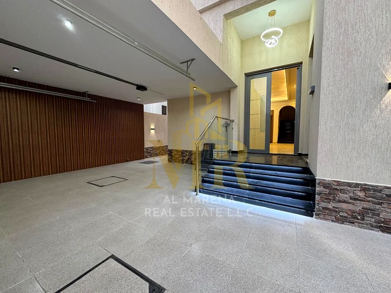 🏡 For Sale – Luxury Villa in Al Bahia – Ajman | 2 Floors + Roof | 6 Master Bedrooms | Majlis + 3 Living Halls | 3 Modern Kitchens | Maid’s Room | Roo63882551649794111