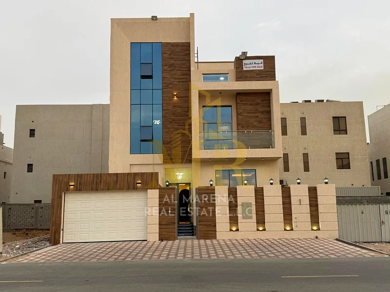 🏡 For Sale – Luxury Villa in Al Bahia – Ajman | 2 Floors + Roof | 6 Master Bedrooms | Majlis + 3 Living Halls | 3 Modern Kitchens | Maid’s Room | Roo63882551649794114