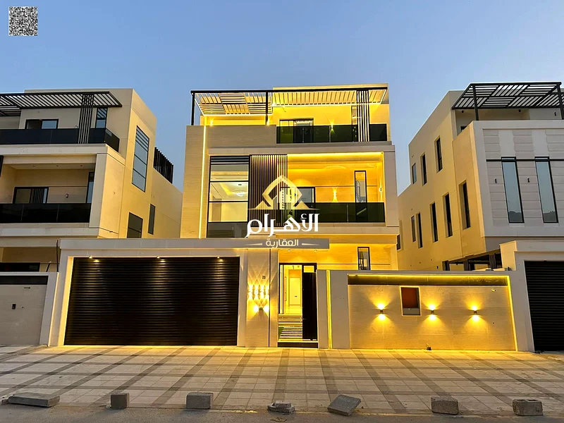 Villa for sale in Ajman, Al Bahia area. The villa consists of three floors, a swimming pool, 5 master bedrooms with closets, a sitting room, 3 halls,63881146957187111