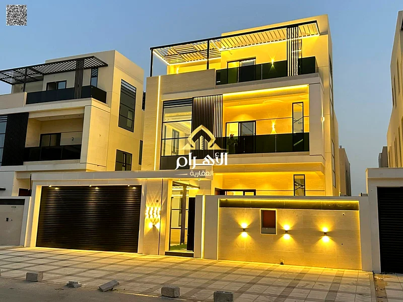 Villa for sale in Ajman, Al Bahia area. The villa consists of three floors, a swimming pool, 5 master bedrooms with closets, a sitting room, 3 halls,63881146957187110