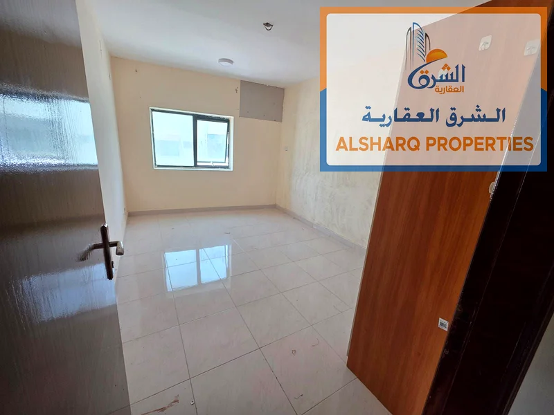 Two-bedroom apartment for annual rent in Ajman Corniche, second row, excellent new building, spacious areas, equipped kitchen, balcony with a wonderfu63810725758082111