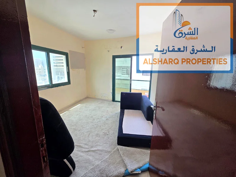 Two-bedroom apartment for annual rent in Ajman Corniche, second row, excellent new building, spacious areas, equipped kitchen, balcony with a wonderfu63810725758082110