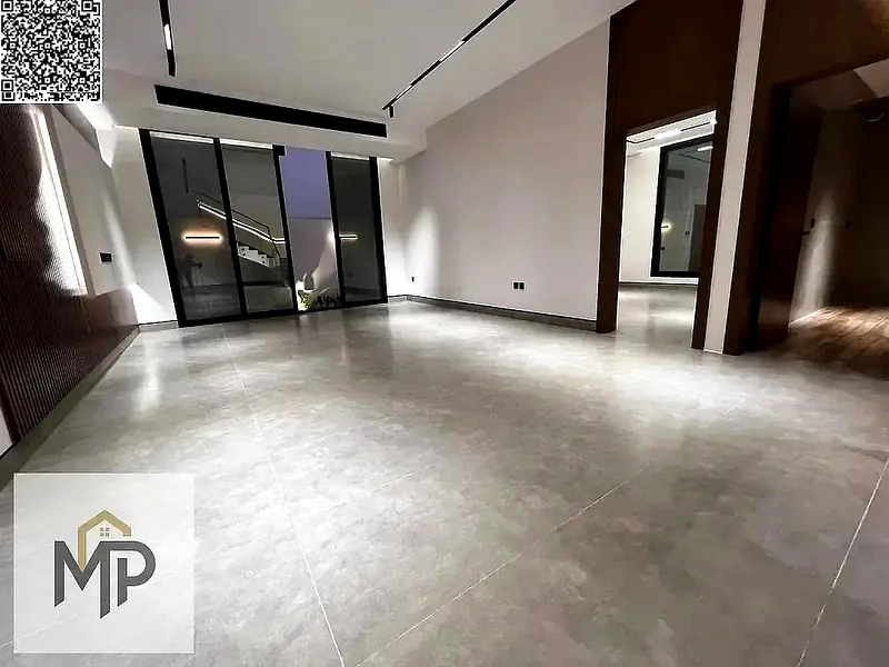 Villa for sale - two floors and a large courtyard - close to Sheikh Mohammed bin Zayed Road - freehold for all nationalities for life -63880510949507114