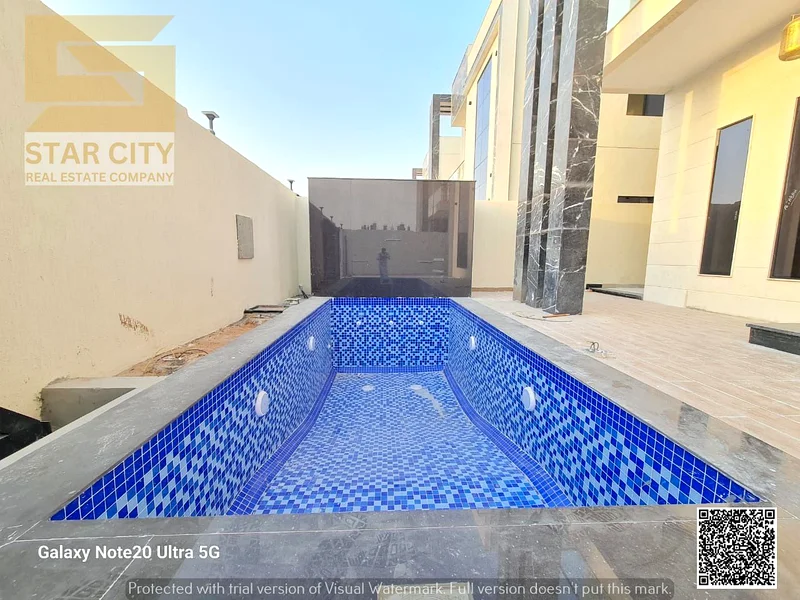 For sale - a luxury villa with a swimming pool in a prime location in Ajman, high-end finishing, modern design, including registration and owners63913993942786111