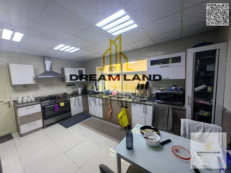For sale - Villa in Al Rawda 2 - Ajman | Two floors | 5 master bedrooms | Majlis and hall | Spacious yard | On main street | Close to services | Freeh63878711528706110