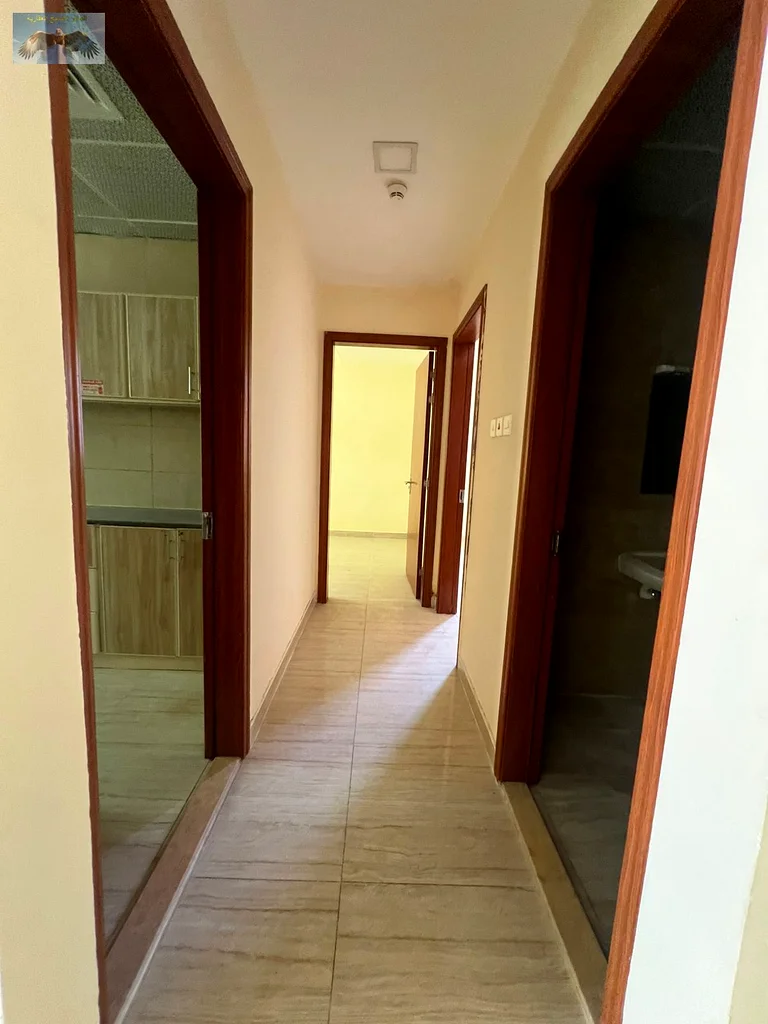 First-class apartment for rent in Al Rashidiya 2 - 2 bedrooms, a spacious hall with 2 bathrooms and a large balcony, built-in wardrobes and high-end f63721614318467113