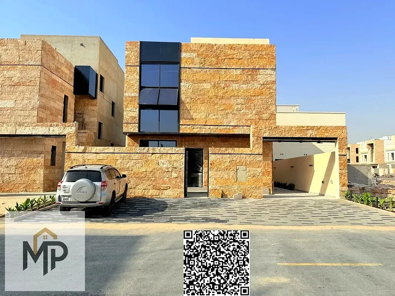 Villa for sale - two floors and a large courtyard - close to Sheikh Mohammed bin Zayed Road - freehold for all nationalities for life -63882550783873111