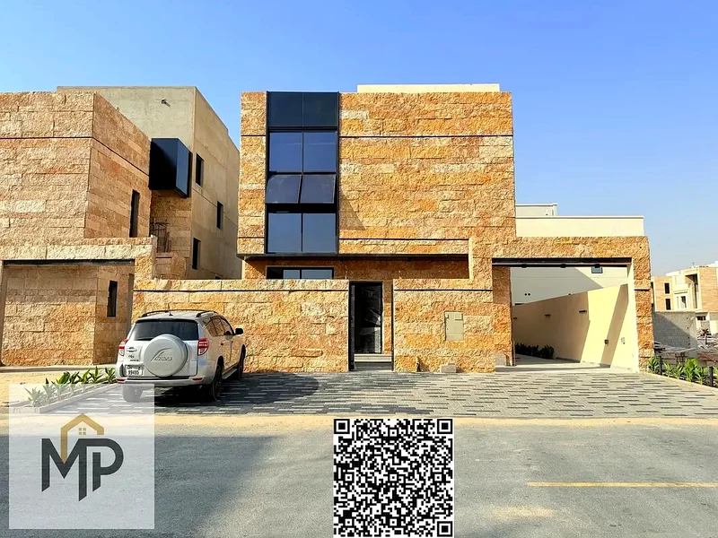 Villa for sale - two floors and a large courtyard - close to Sheikh Mohammed bin Zayed Road - freehold for all nationalities for life -63882550783873110