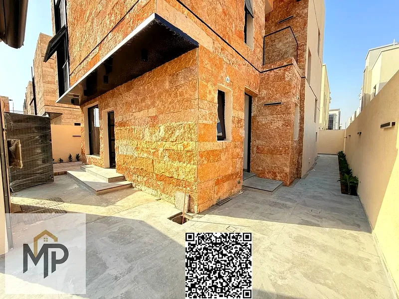 Villa for sale - two floors and a large courtyard - close to Sheikh Mohammed bin Zayed Road - freehold for all nationalities for life -63882550783873113
