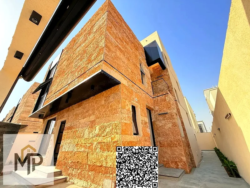 Villa for sale - two floors and a large courtyard - close to Sheikh Mohammed bin Zayed Road - freehold for all nationalities for life -63882550783873114
