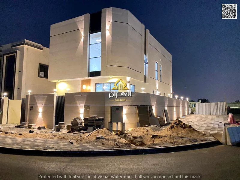 For sale, a corner villa in Al Helio 2 - Ajman, directly from the owner, in a prime location and excellent space. Registration fees included.63905344440066112