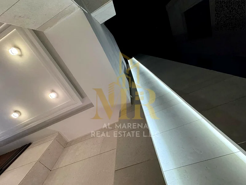 A villa with a price including registration and ownership fees on the main street, ready for occupancy in the most upscale areas of Ajman, freehold fo63905218403843113