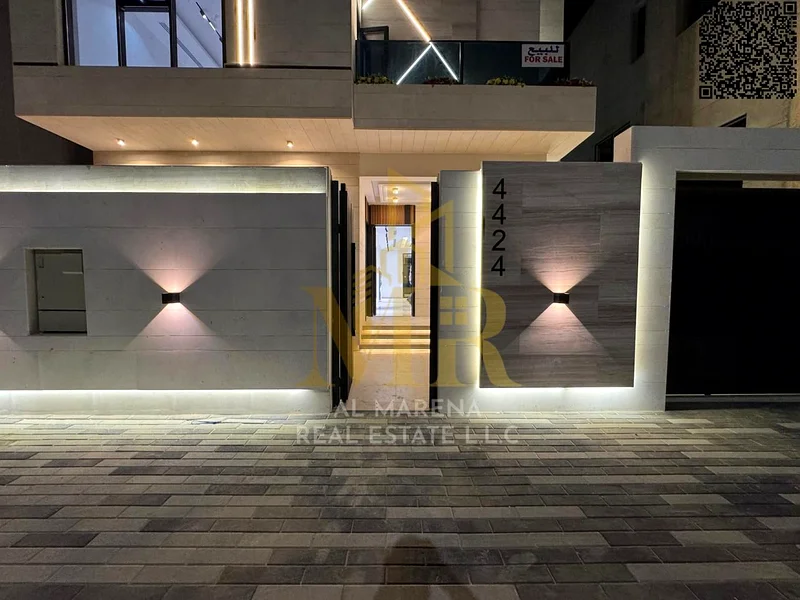 A villa with a price including registration and ownership fees on the main street, ready for occupancy in the most upscale areas of Ajman, freehold fo63905218403843114