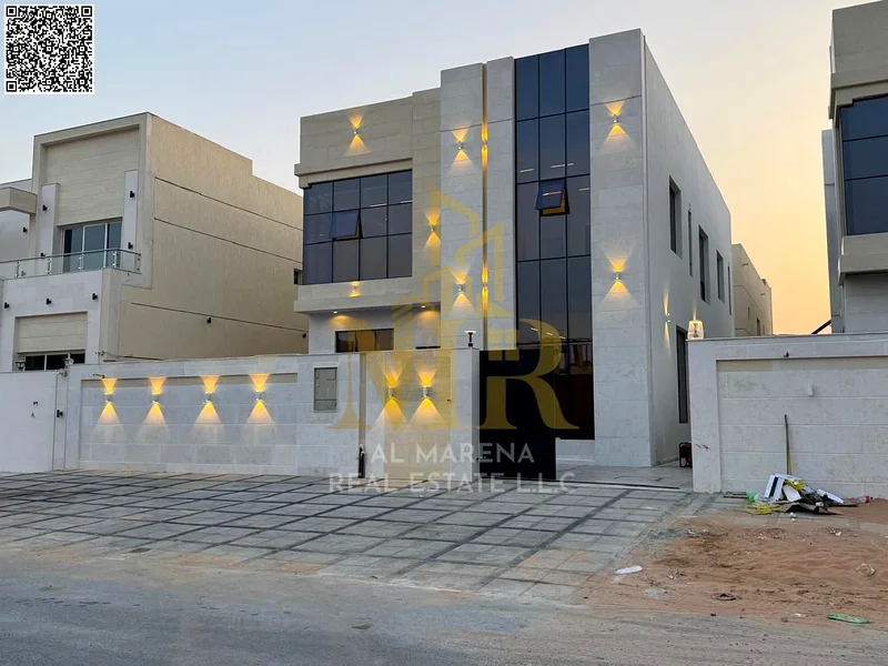A villa with a price including registration and ownership fees on the main street, ready for occupancy in the most upscale areas of Ajman, freehold fo63904697906433110