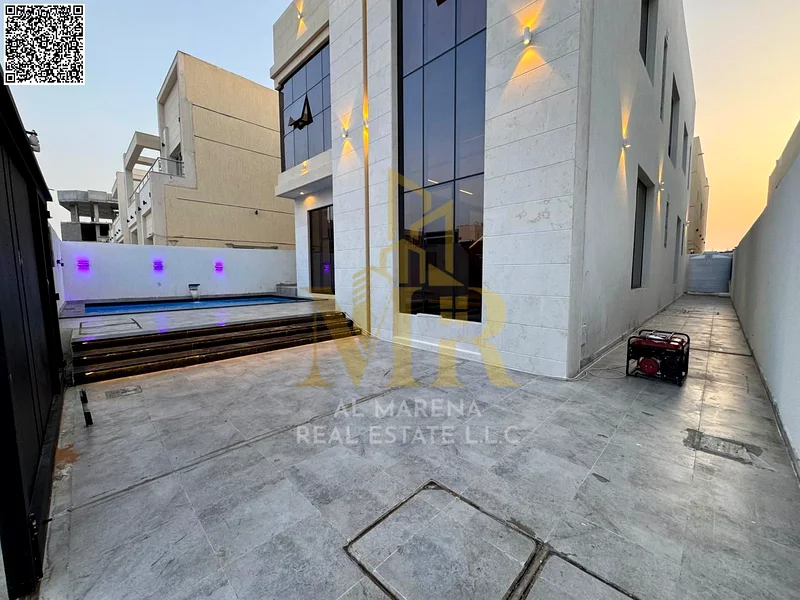 A villa with a price including registration and ownership fees on the main street, ready for occupancy in the most upscale areas of Ajman, freehold fo63904697906433113