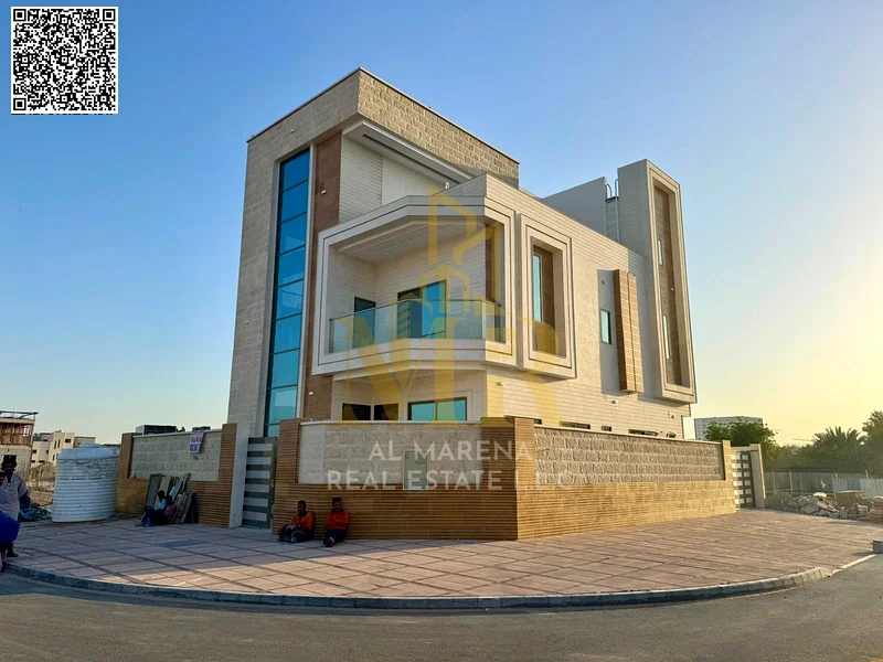 A villa with a price including registration and ownership fees on the main street, ready for occupancy in the most upscale areas of Ajman, freehold fo63904245577731111