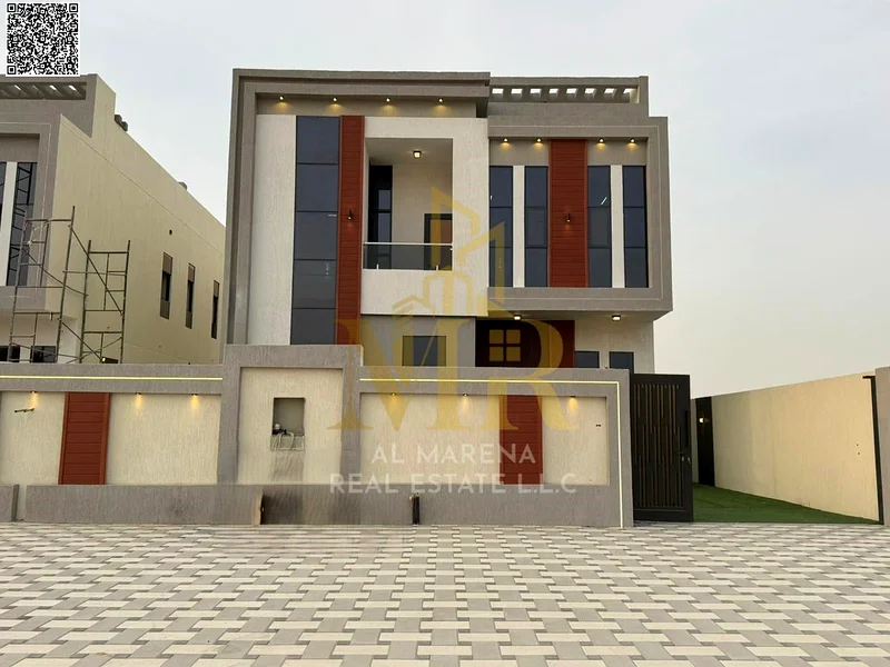 A villa with a price including registration and ownership fees on the main street, ready for occupancy in the most upscale areas of Ajman, freehold fo63892909448066111