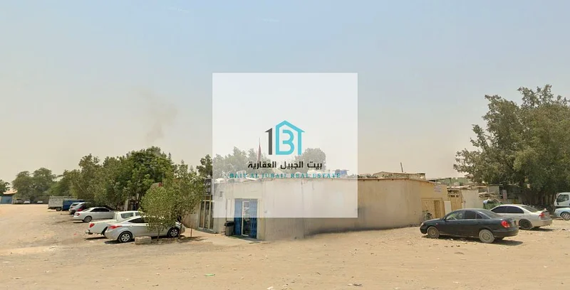 ساحة استثمارية في منطقة الساجا الصناعية - موقع زاوي متميز على طريقين رئيسيين63819129570306111