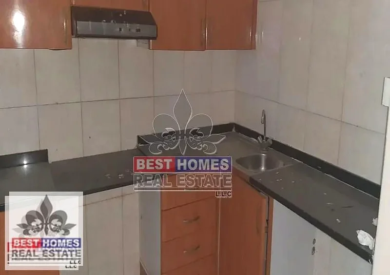 شقة نظيفة غير مفروشة من غرفة نوم واحدة متاحة للإيجار في برج النعيمية، عجمان63816675547266113